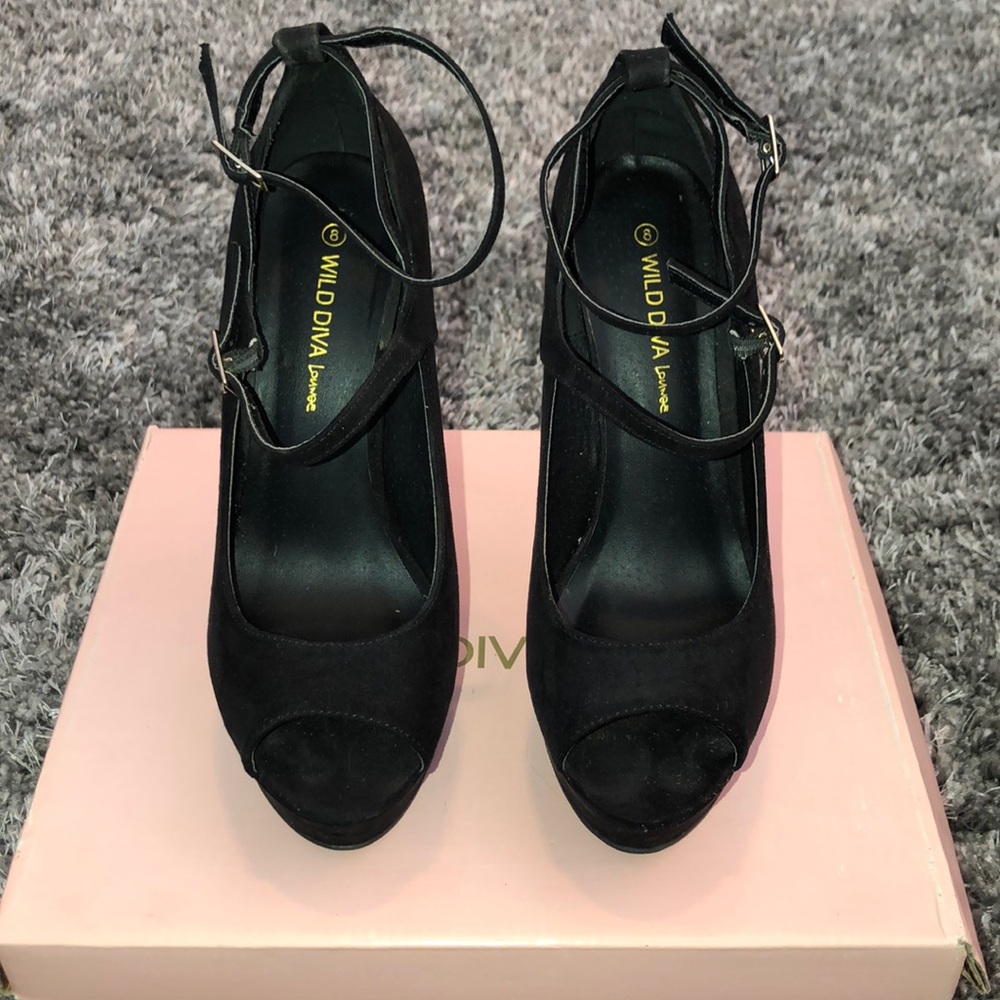 Women’s black strap heels.